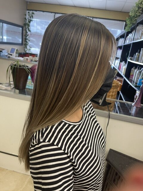 Relaxing modern salon interior with styling chairs at Elaina Hair.