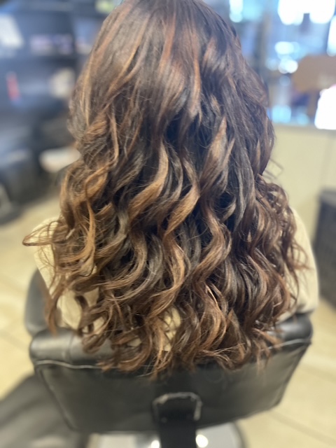 Personalized haircut consultation session between stylist and client.